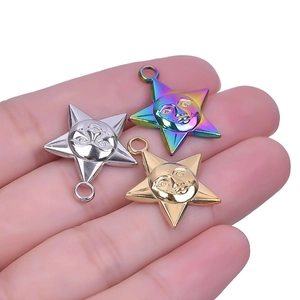 Minimalist stainless steel star face charms in silver, gold, and rainbow finishes