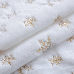 White faux fur Christmas table runner with gold sequin snowflake patterns for home decor