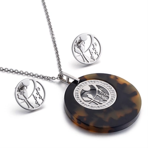 Silver bird tree pendant necklace and stud earrings set with tortoiseshell resin accents