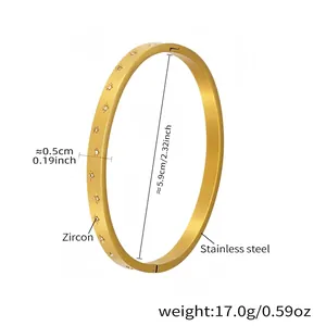 Detailed close-up of 18k gold plated stainless steel cuff bracelet with star zircon inlay