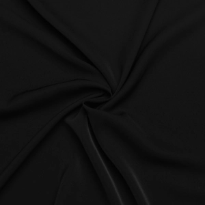 Close-up of black fabric texture showing elegant draping and smooth professional finish