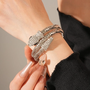 Macro shot of silver snake bracelet with honeycomb scales and crystal pave detail