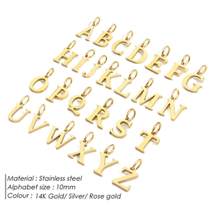 Detail view of 26 alphabet charms in 14K gold stainless steel for DIY jewelry