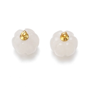 Detailed view of two white pumpkin-shaped quartz pendants with gold-plated ring loops