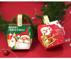 Detail of red and green Santa gift boxes with golden handles and Christmas patterns