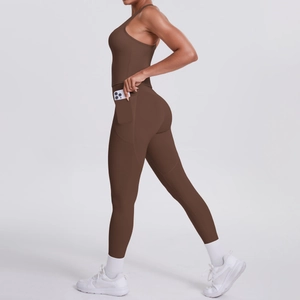 Detail showing high-elastic yoga jumpsuit with a functional side phone storage pocket
