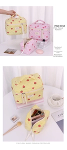 Detail of strawberry quilted makeup bag showing soft cotton fabric and zipper interior