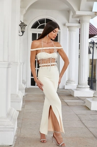 Detail of off-shoulder fishtail dress with elegant crystal beaded body chain accessories