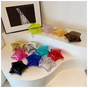 Close-up of star-shaped acrylic mini bags in vibrant transparent and metallic colors