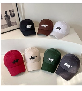 Detailed close-up showing diverse embroidered colors of the HEARTS cotton baseball caps