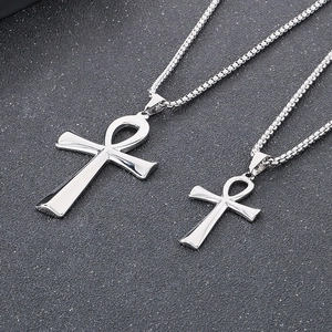 Macro detail of silver Ankh cross pendants in two sizes with stainless steel box chains