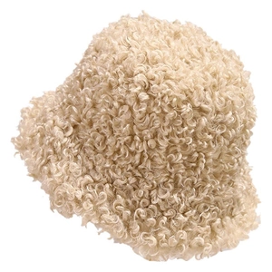 Plush cream faux fur bucket hat with warm curly texture for women in winter