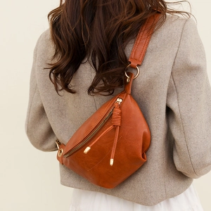 Retro brown soft leather crescent crossbody bag shown on model with adjustable strap