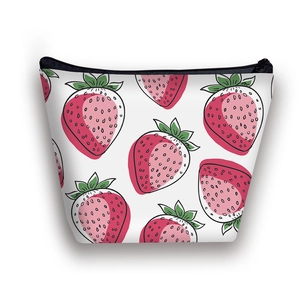 Portable toiletry bag with vibrant strawberry print and black zipper on white canvas fabric