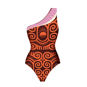 Detail of bohemian tribal print on one-shoulder swimsuit with sun and swirl patterns