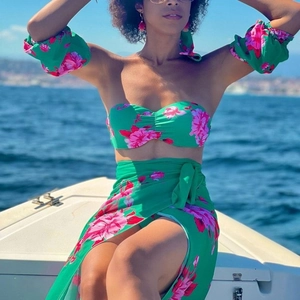 Detail of floral bikini top with puff sleeves and matching beach sarong on a yacht