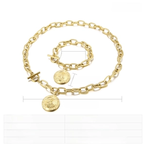 Detailed view of gold stainless steel chunky chain jewelry set with religious coin pendant