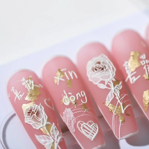 3D embossed pink matte press-on nails with rose patterns and gold foil accents