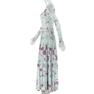 Detail view of long sleeve floral dress with light blue base and pink flower pattern