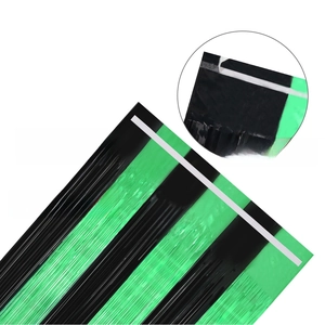 Detail of green and black foil fringe curtain with adhesive backing for party setup