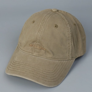 Detail shot of khaki washed cotton baseball cap with embroidered logo and stitching