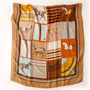 Detail of equestrian horse print scarf featuring multiple patterned blanket motifs in grids