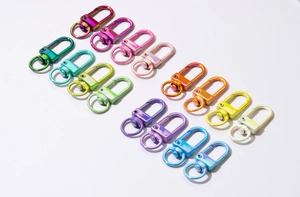 Close-up of colorful alloy spring buckles in various gradient electroplated finishes