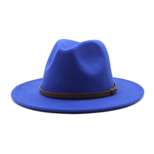 Detail of royal blue wool fedora hat featuring a slim brown embossed leather band