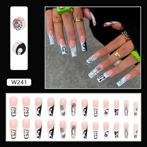 Long coffin fake nails with black and white hand-painted daisy and flame motifs