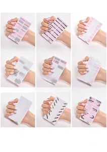 Detailed grid showing minimalist nail sticker designs including glitter and gradients