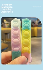 Close-up of macaroon gradient pop-it silicone bracelet with silver metal buckle detail