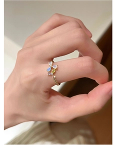 Macro detail of S925 silver flower ring with pearl and colorful gemstone clusters