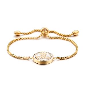 Golden titanium steel bracelet with diamond frame and Mãe mother shell pendant