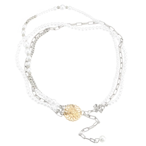 Layered pearl and chain necklace featuring a gold lion head pendant in a luxury style