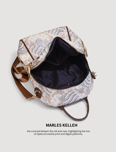 Detail view of oriental cloud pattern backpack with spacious interior and gold zippers