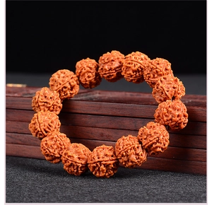Detailed close-up of Rudraksha prayer beads with natural textures on a wooden box