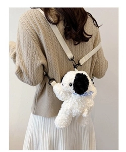 Detail of cute white plush dog bag with blue checkered scarf and beige canvas strap