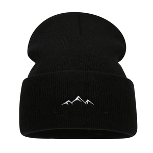 Minimalist black knit beanie with mountain embroidery for outdoor winter warmth