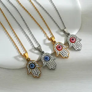 Hamsa hand necklace in stainless steel with evil eye pendant and crystal accents