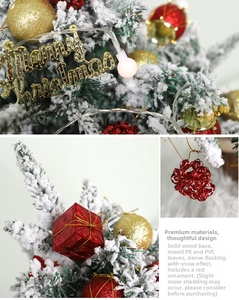 Detail view of snowy flocked Christmas tree with Merry Christmas light and red ornaments