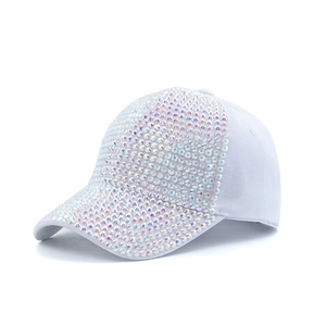 Close-up detail of white baseball cap encrusted with shimmering colorful rhinestones