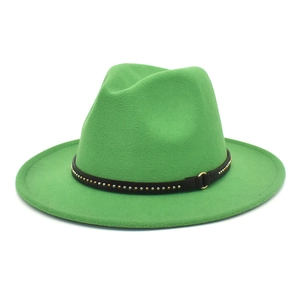 Detail of green fedora hat with black decorative band featuring metallic studs and buckle