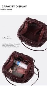 Internal capacity view of burgundy ruched cloud bag showing phone and cosmetics storage
