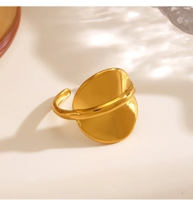 Detail of 18K gold plated stainless steel ring with unique irregular disc design