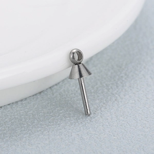 Cone-shaped 316L stainless steel stud earring finding with top hanging loop on a white plate
