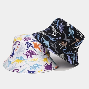 Reversible bucket hat with cartoon dinosaur prints in black and white cotton twill fabric