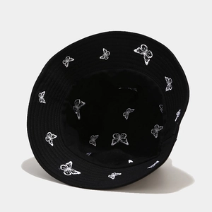 Reversible black bucket hat with white butterfly embroidery for sun protection