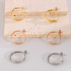 Detailed trio of C-shaped wheat pattern earrings in gold, rose gold, and silver finishes