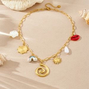 Golden multi-charm chain necklace featuring spiral sun and rainbow pendants on sandy beach