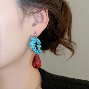 Ethnic style silver stud earrings with turquoise beads and red crystal waterdrop pendant